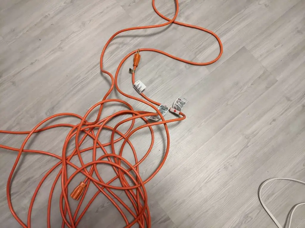 red extension cord on the floor
