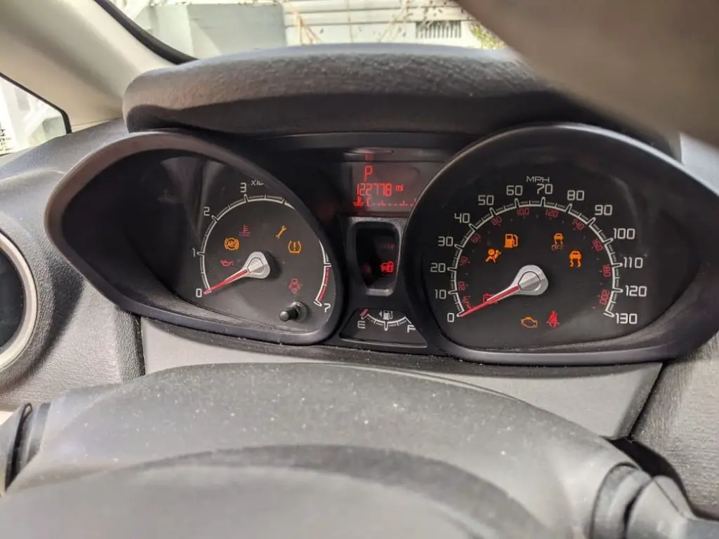 car dashboard with engine lights on